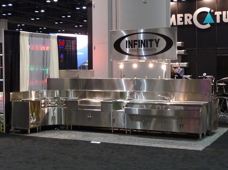image of NAFEM trade show booth showing various stainless steel backbar equipment