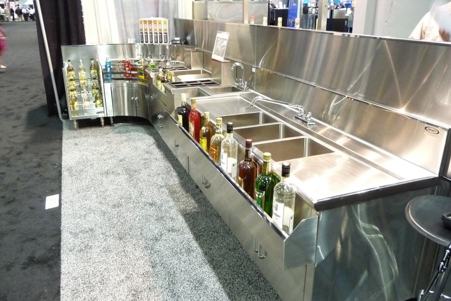 image of custom stainless steel backbar equipment with bottles in hang on rails