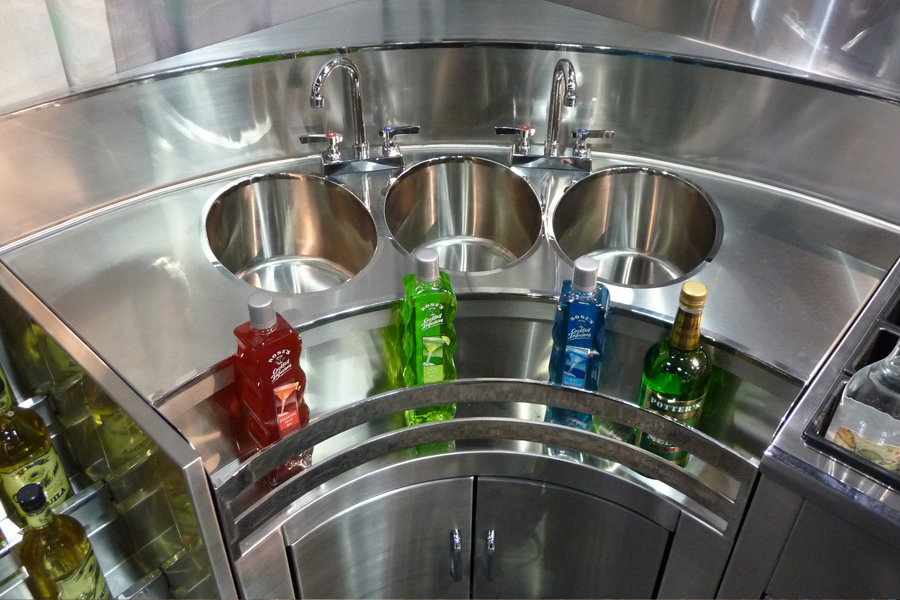Image of custom 3 bowl sink at NAFEM trade show booth