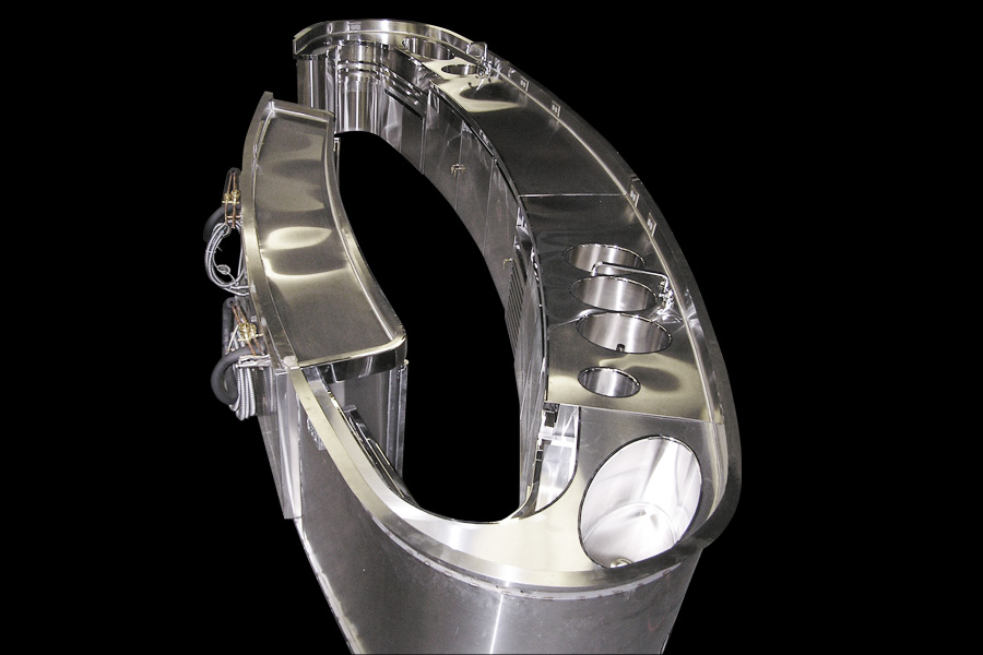 image of custom stainless steel architectural equipment in the shape of an oval with Mixology station, dump sink and two 3 compartment sinks at New York Palace Hotel