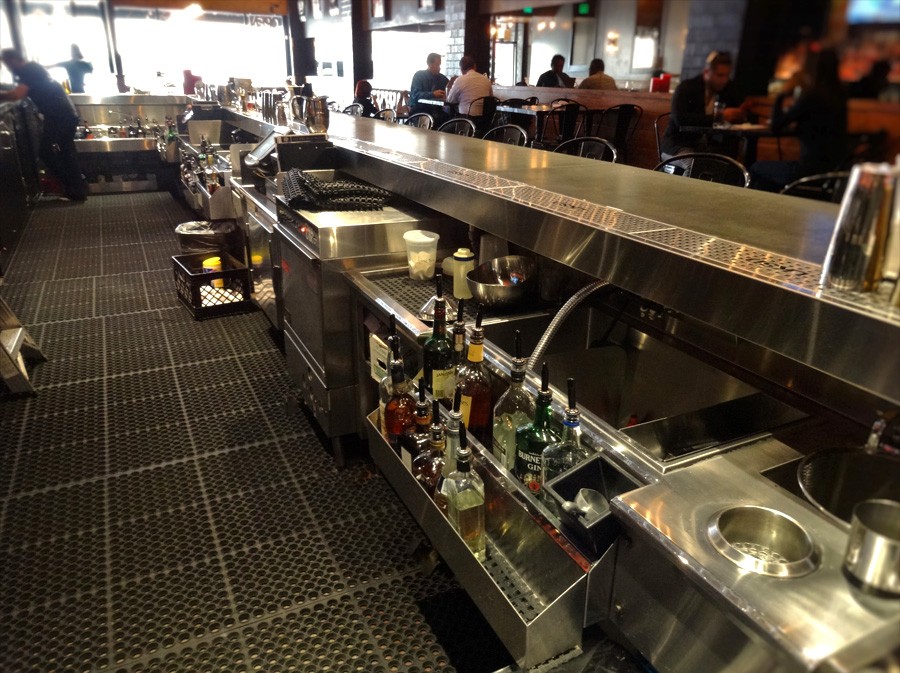 image of back of bar showing mixology station, beverage dispensing station and other back bar equipment